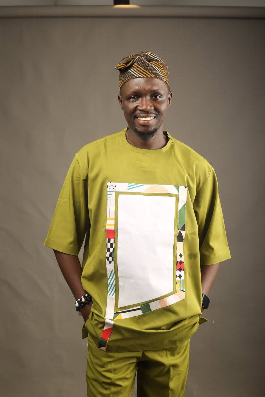 Afeez Ayomide Olagunju, portrait in a green agbada